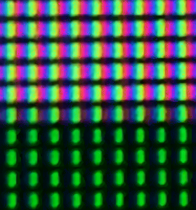 A close-up photograph of one course instructor’s LCD screen, showing white above and darker green below. Each (blue, green, red) grouping is one pixel. Colors in the photo are a bit off because the camera’s color receptors did not perfectly match the screen’s color emitters.