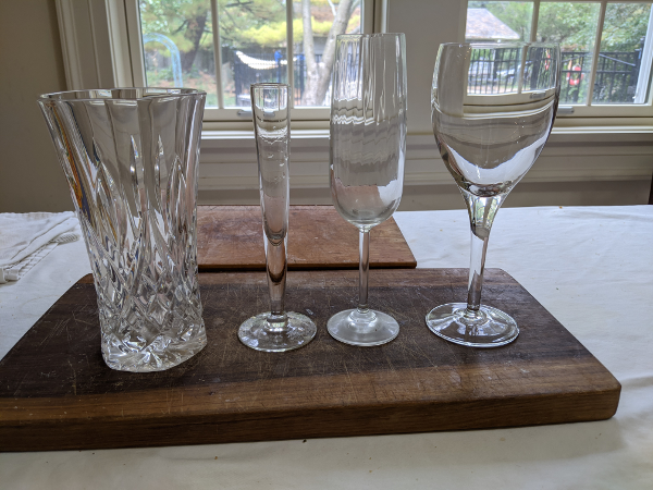 a vase, a maybe vase, and two wine glasses