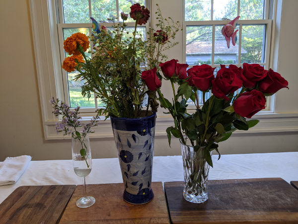 three vases with flowers