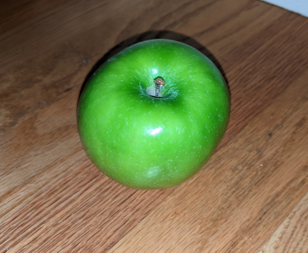apple in directional lighting