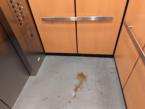coffee spill on elevator floor