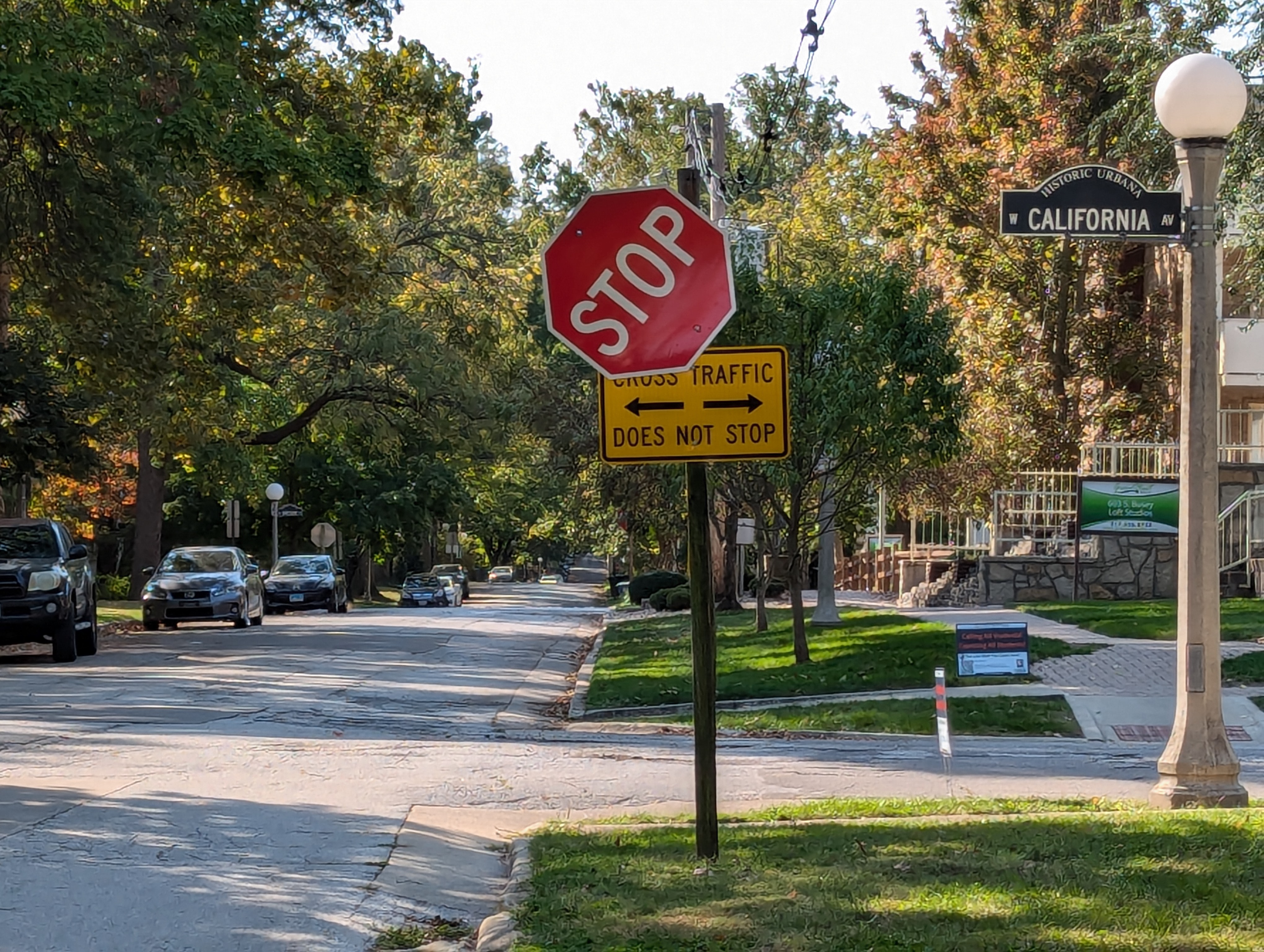stop sign tilted at an angle to its supporting post